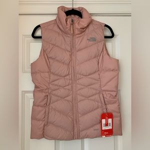 Light pink women’s The North Face vest size Small!